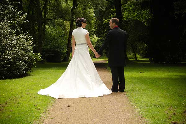 bride and groom holding hands